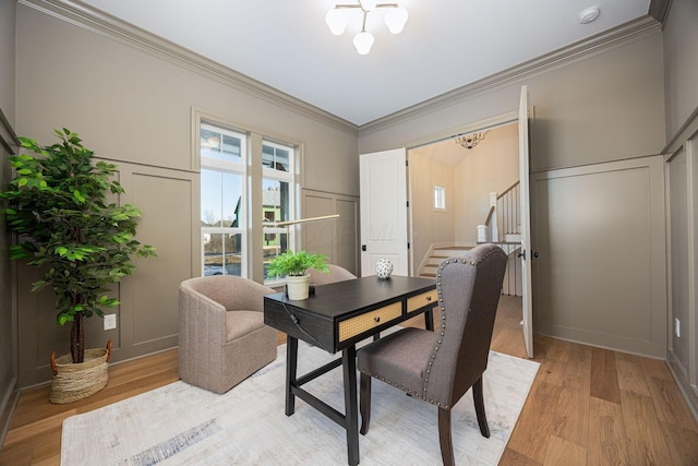 home office with ornamental molding and light wood-type flooring