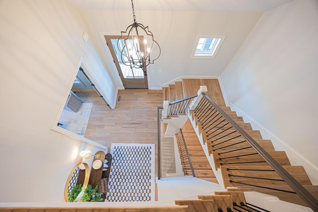 foyer featuring a chandelier and hardwood / wood-style floors