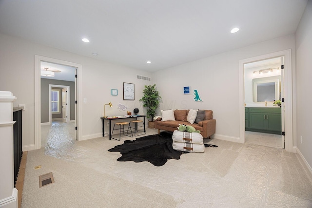 living room featuring light carpet