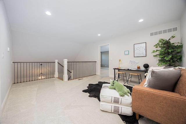 living room featuring light colored carpet and lofted ceiling