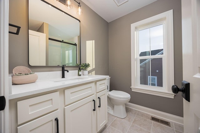 bathroom with vanity, tile patterned flooring, a shower with shower door, and toilet