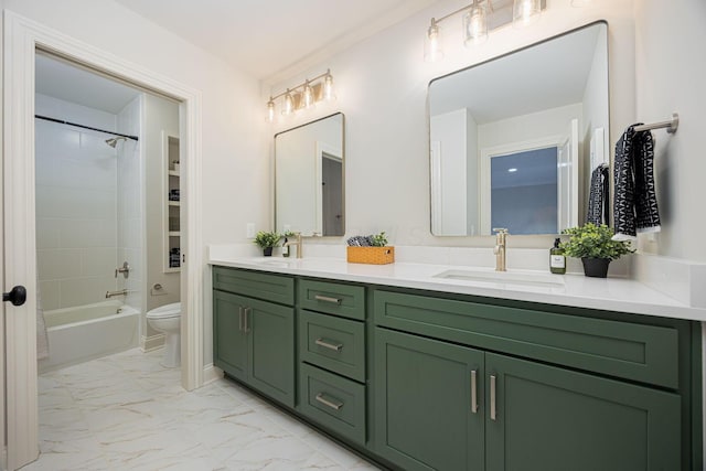 full bathroom featuring vanity, tiled shower / bath, and toilet