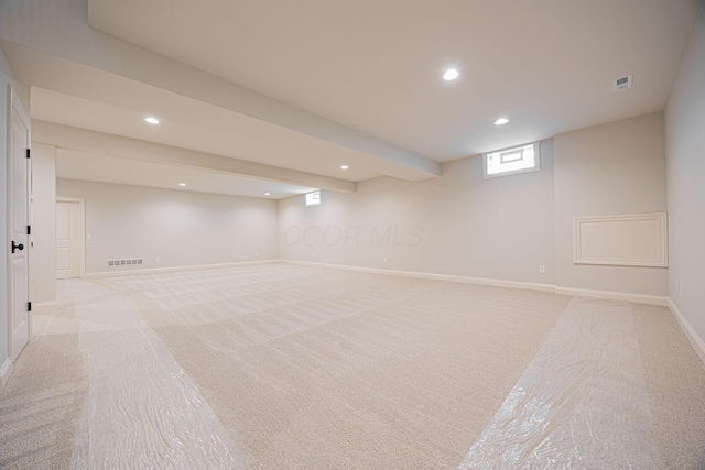 basement with light carpet