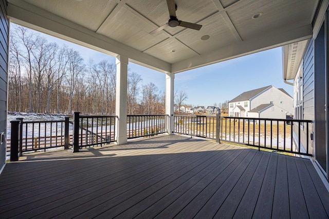 wooden deck featuring ceiling fan