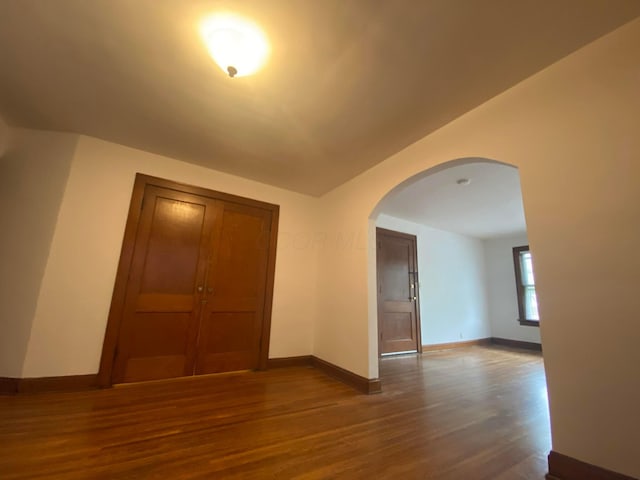 unfurnished room featuring wood-type flooring