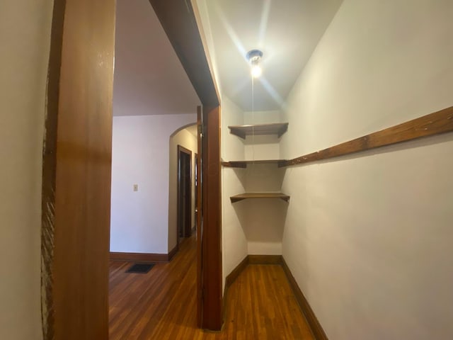 walk in closet featuring dark hardwood / wood-style flooring