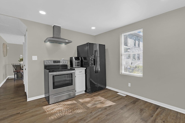 kitchen with wall chimney range hood, black fridge with ice dispenser, stainless steel electric stove, and dark hardwood / wood-style floors