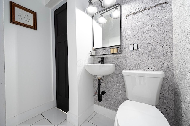 bathroom featuring tile patterned floors and toilet