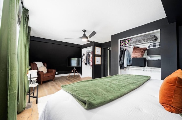 bedroom featuring wood-type flooring and ceiling fan