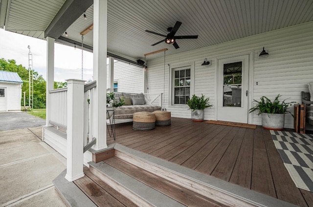 deck with covered porch and ceiling fan