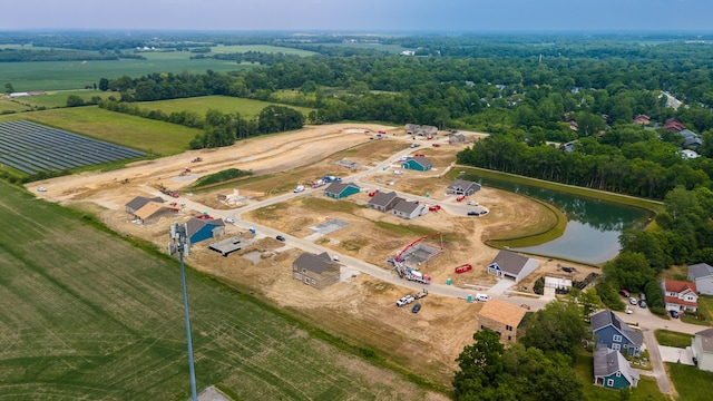 drone / aerial view featuring a rural view and a water view