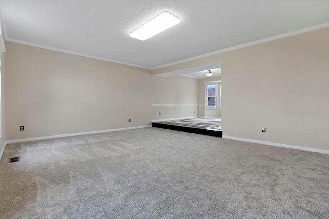 unfurnished room with ornamental molding, baseboards, visible vents, and carpet flooring