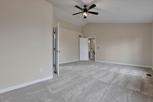 interior space featuring lofted ceiling, carpet, visible vents, and baseboards