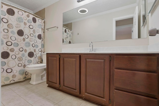 bathroom featuring tile patterned floors, vanity, toilet, and crown molding