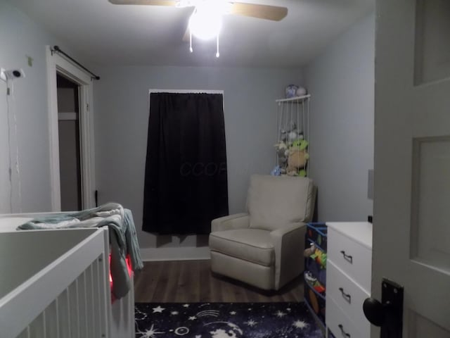 bedroom with dark wood-type flooring and ceiling fan