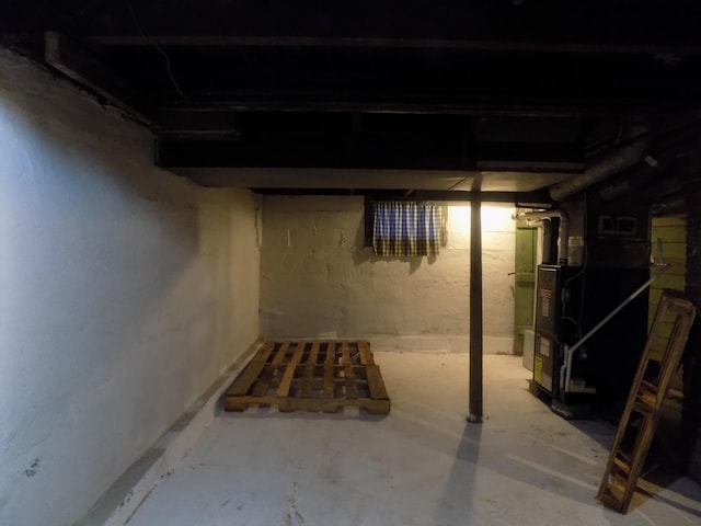 basement featuring heating unit