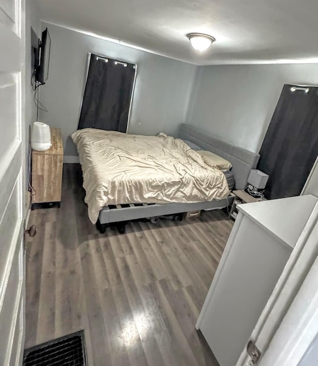 bedroom with wood-type flooring