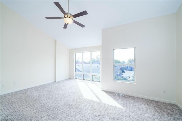 unfurnished room with ceiling fan and carpet flooring