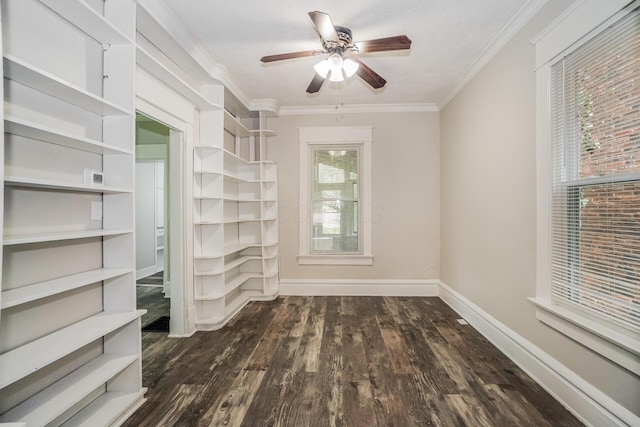 empty room with crown molding, ceiling fan, and dark wood-type flooring