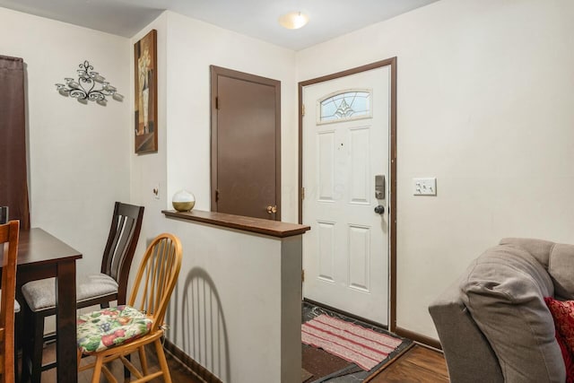 foyer entrance with dark hardwood / wood-style flooring