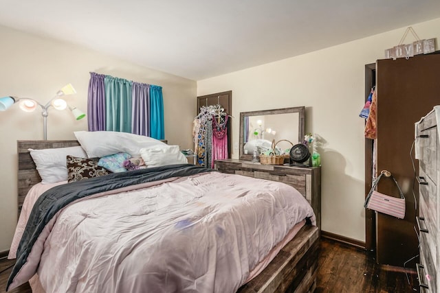 bedroom featuring dark wood-type flooring