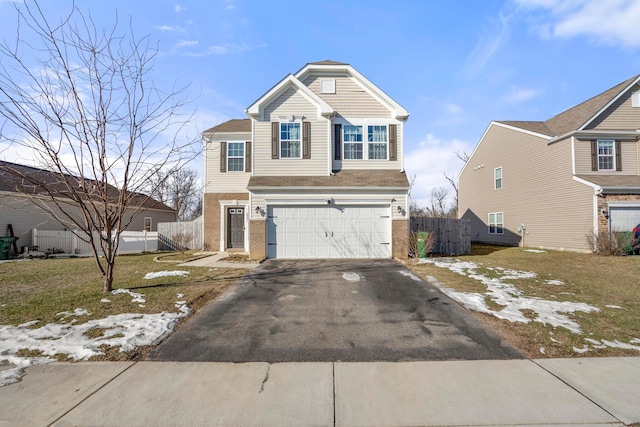 view of front property with a garage and a front yard