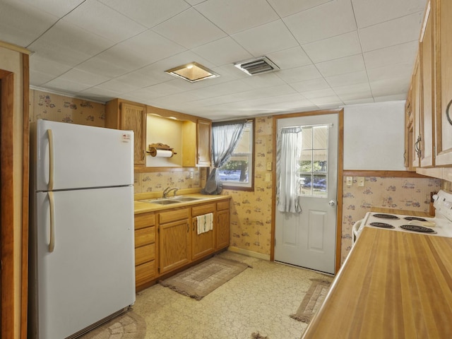 kitchen with sink and white appliances