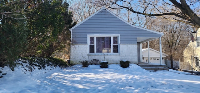 view of front of home featuring an outbuilding and a garage