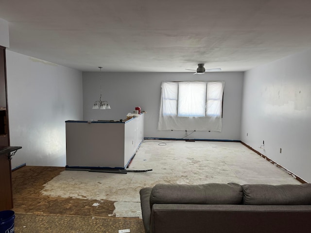 unfurnished living room featuring ceiling fan