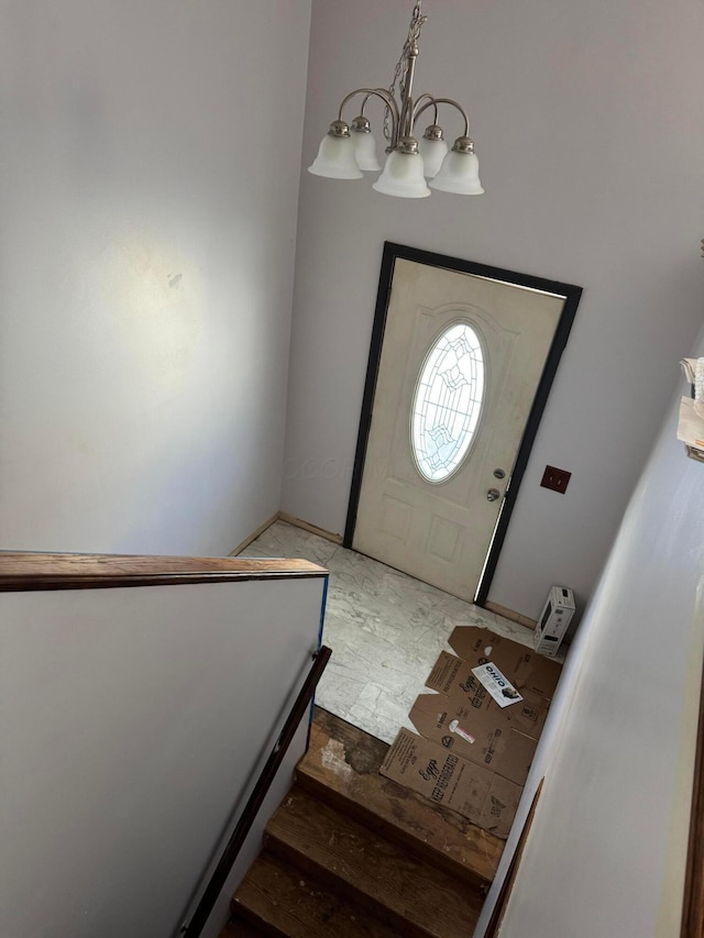 entrance foyer featuring a chandelier