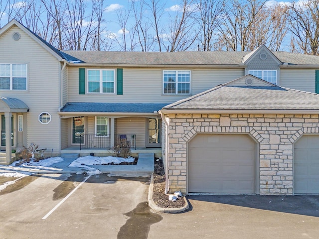 view of front of house with a garage and covered porch