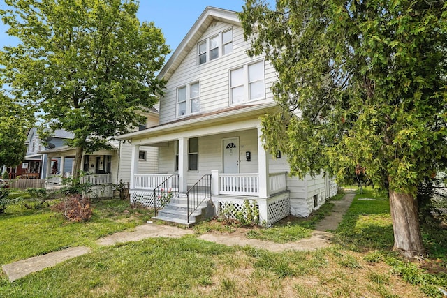 view of front facade featuring a front lawn and a porch