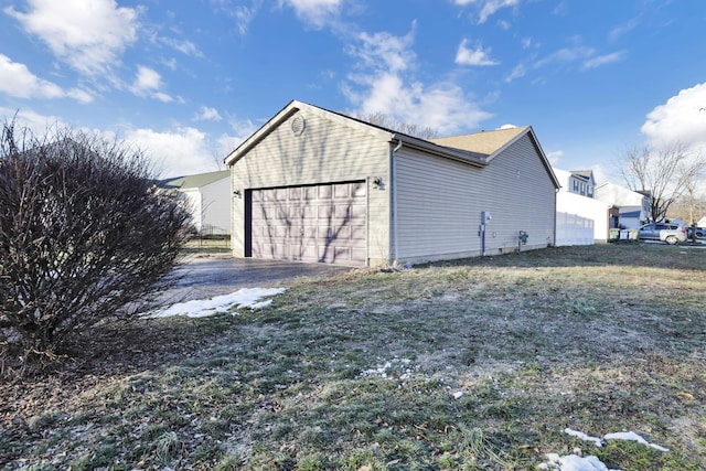 garage featuring a yard