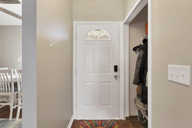 doorway featuring dark wood-type flooring