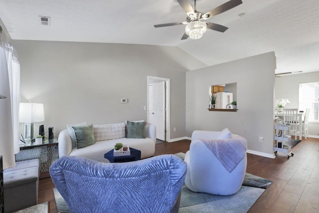 living room with lofted ceiling, dark wood-type flooring, and ceiling fan