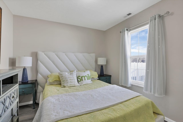 bedroom featuring dark wood-type flooring