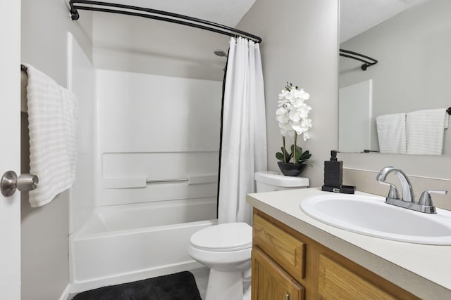 full bathroom with shower / bathtub combination with curtain, vanity, and toilet