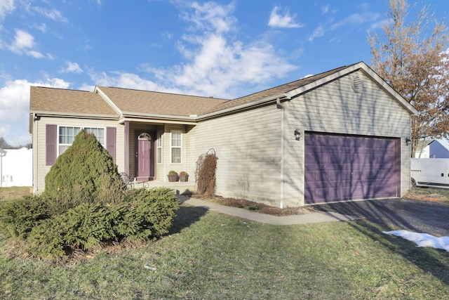 ranch-style home featuring a garage and a front lawn