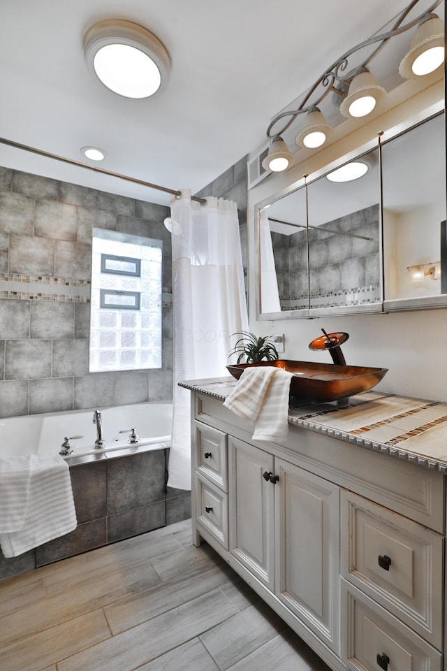 bathroom with shower / tub combo with curtain and vanity