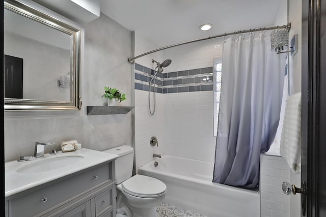 full bathroom featuring vanity, toilet, and shower / tub combo with curtain