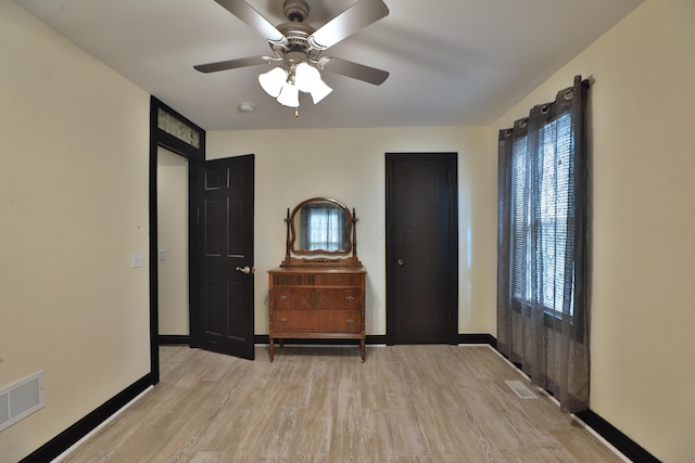 interior space with ceiling fan and light hardwood / wood-style floors