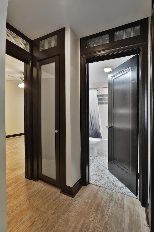 hall with light hardwood / wood-style floors