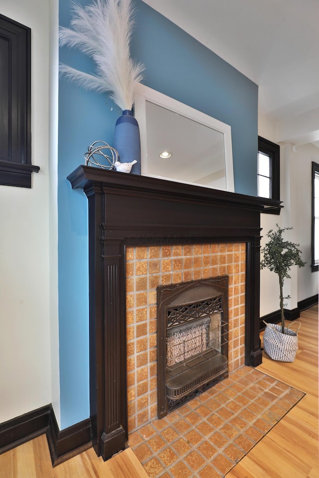 interior details with a fireplace and hardwood / wood-style floors