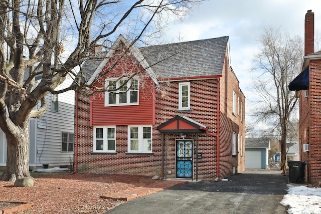 tudor home featuring a garage