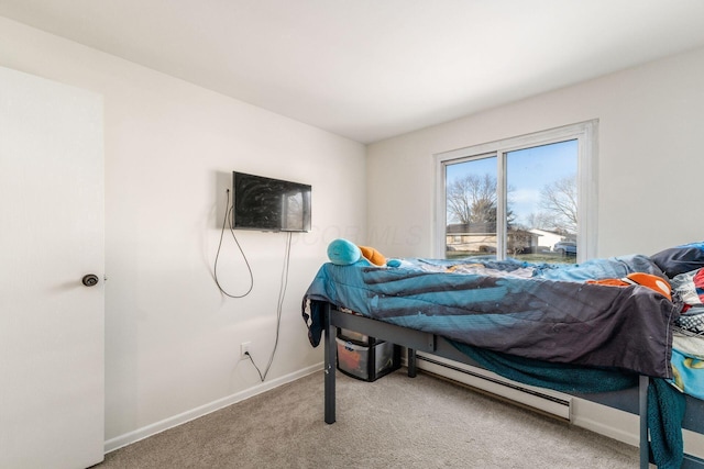 bedroom featuring baseboard heating and carpet flooring