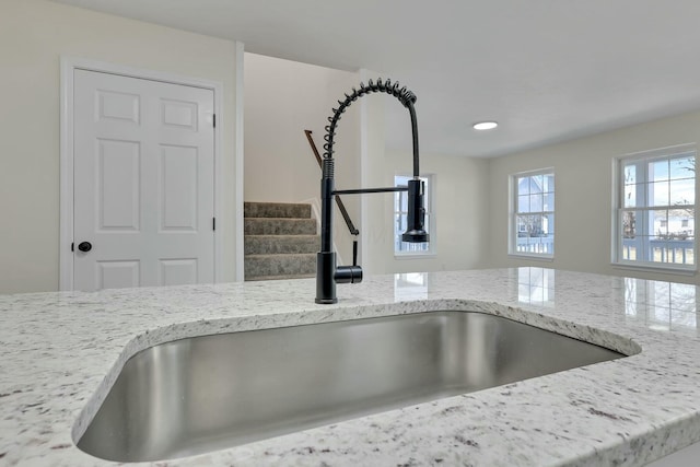 interior details with sink and light stone counters