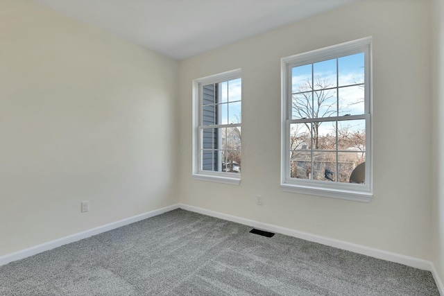 unfurnished room featuring carpet flooring