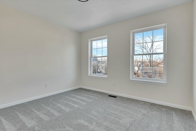 unfurnished room featuring carpet floors