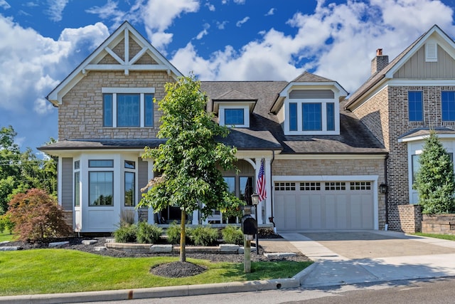 view of front of house featuring a garage and a front lawn