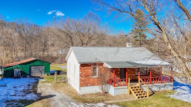 exterior space featuring a garage and a porch